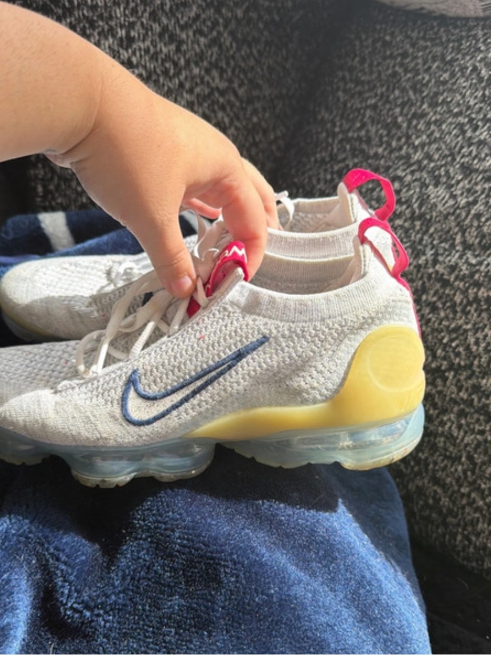 Nike Womens White Flyknit Sneakers with Blue Swoosh and Yellow Heel